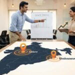 Startup Grants India 2025: Which State Gives Max ‘Free Money’? (₹22 Lakhs+) Two Indian startup founders standing in front of a map of India with upward growth arrows, illustrating the Startup Grants India 2025 report.