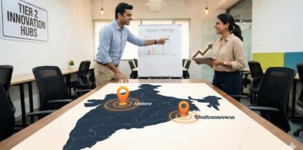 Hidden Hubs 2025: Ranking India’s Top Tier-2 Startup Cities by Livability & Talent (Beyond Bangalore) Two Indian startup founders standing in front of a map of India with upward growth arrows, illustrating the Startup Grants India 2025 report.